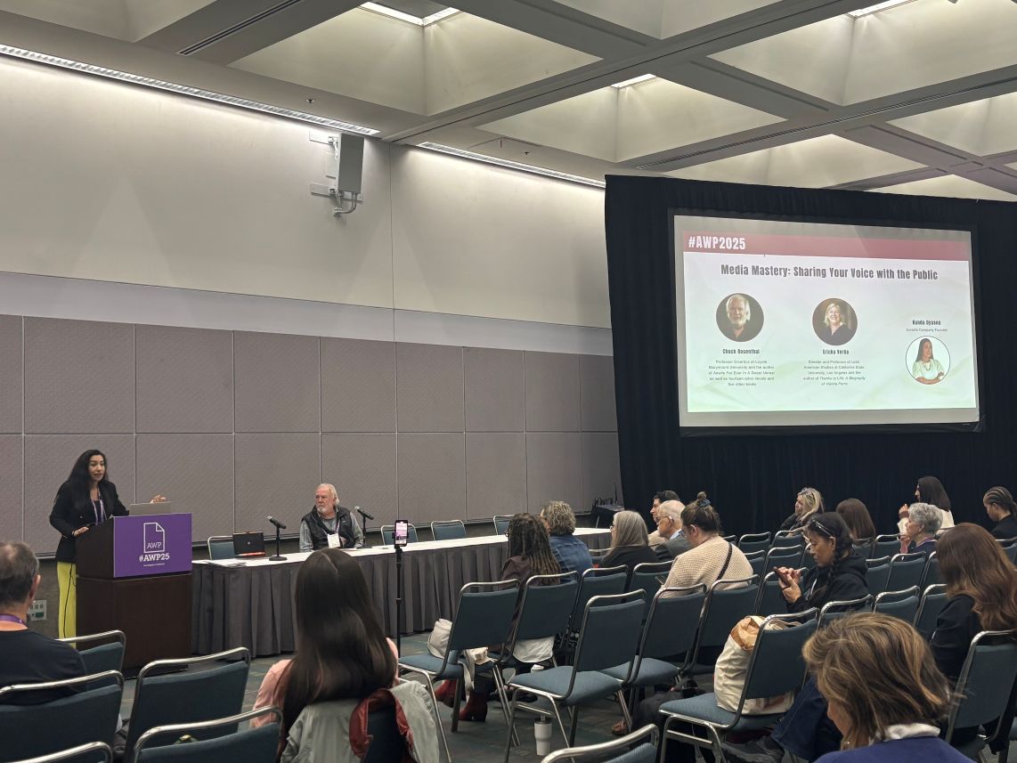 Media Mastery: Sharing Your Voice with the Public Wide shot of the Media Mastery workshop at AWP 2025, with Nanda Dyssou, Professor Chuck Rosenthal, and Professor Ericka Verba presenting to a full audience at the Los Angeles Convention Center.
